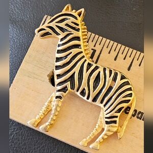 Gold tone zebra broach